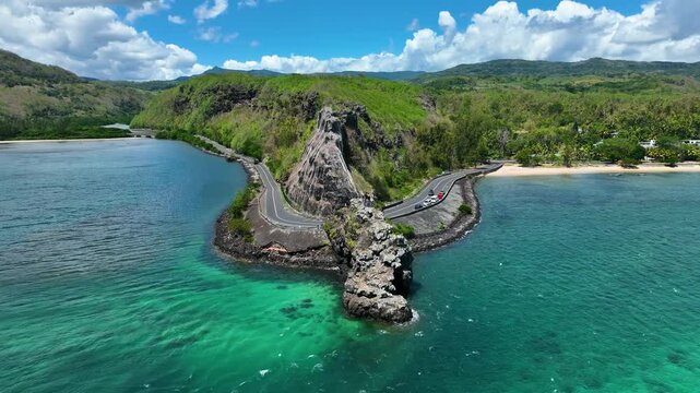 Aerial view of the emerald Indian Ocean meeting cliffs and coastal curves at the famous Maconde Viewpoint, Mauritius