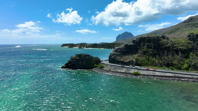 Aerial view of the emerald Indian Ocean meeting cliffs and coastal curves at the famous Maconde Viewpoint, Mauritius