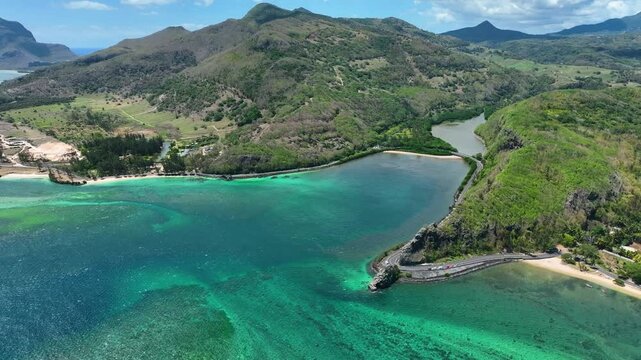 Aerial view of the emerald Indian Ocean meeting cliffs and coastal curves at the famous Maconde Viewpoint, Mauritius