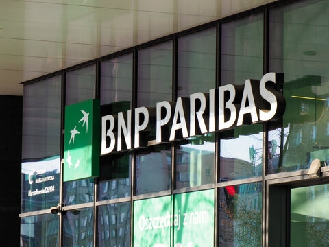 Close-up of BNP Paribas Bank Sign on Contemporary Glass Office Building with Green Corporate Branding