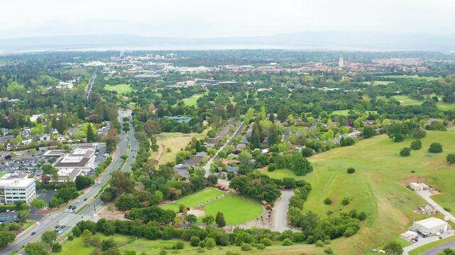 Aerial moving shot of Menlo Park Palo Alto Silicon Valley Stanford green tree