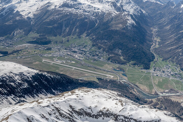 aerial landscape with Samedan and Bever villages near Engadin airport, Switzerland