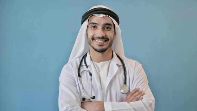 Young Arabian doctor with a stethoscope, smiling in medical uniform