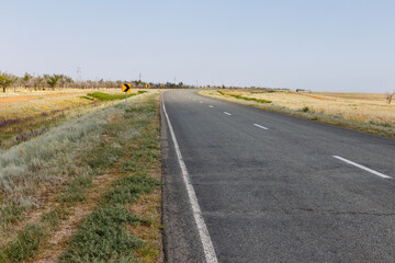 Curved asphalt road A 28 in Akzhaik District West Kazakhstan Region with surrounding landscape