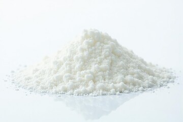 Pile of white granulated sugar on white background, shiny, sweetener, recipe