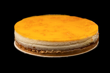 Orange cheesecake isolated on a white background.