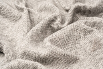 Grey wool sweater texture as a background.