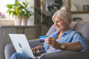 Woman at home shopping online with laptop

