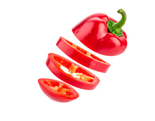 whole red chili pepper sliced into rings and falling in mid-air, isolated on white background
