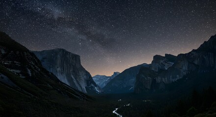 A deep mountain valley under a starry sky