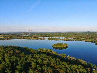 Aerial panorama of islets on large lake, enhancing biodiversity and serving as bird nesting sites in nature reserve small islands for water birds protection