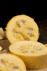 sliced squash with a peel, ripe white squash on the kitchen table during cooking and slicing