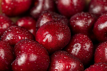 wet red cherry berries in drops of water, wet red cherry fruits on the kitchen table