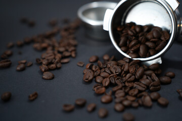 Portafilter, beans, and barista tools on black background—perfect setup for espresso lovers and cafes.