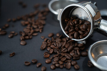 Portafilter, beans, and barista tools on black background—perfect setup for espresso lovers and cafes.