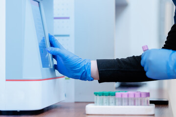 Veterinarian using diagnostic equipment in clinic laboratory for animal health care