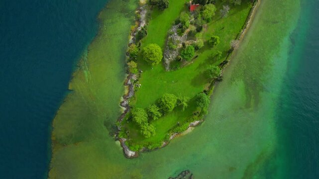 Bird's eye drone footage of the Island of San Biagio on Lake Garda in Brescia, Lombardy, Italy