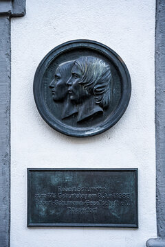 Medallion with the profiles of Clara and Robert Schumann on the facade of Schumann House, museum and historic residence in Bilkerstrasse, D&uuml;sseldorf, Germany.