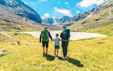 father-sons hiking in the wild improves not only physical health, but also mental health. it is an...