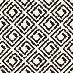 Vector seamless pattern featuring hand-drawn diamond shapes arranged in a grid layout. The rough, irregular edges give the design a tribal, handmade feel, adding visual energy and character—ideal for 