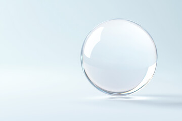 A transparent glass sphere on a soft background, symbolizing clarity and purity.