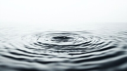 Fototapeta premium Close-up view of water ripples radiating outward.