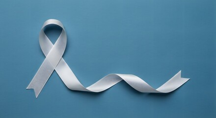 AI image displaying an elegant white satin awareness ribbon lying gracefully curved on a smooth, plain light blue background surface.