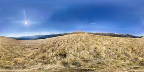 Full Spherical panorama of mountain landscape with clouds and sun