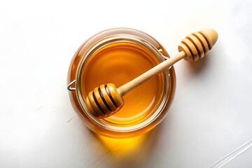 Honey in a Glass Jar with Wooden Dipper