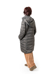 Woman seen from behind, full body with dark green coat.