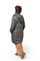 Woman seen from behind, full body with dark green coat.