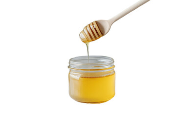 Golden honey drips from a wooden dipper into a clear jar, showcasing its rich texture and color