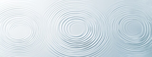 Top view of water ripples on light blue background with abstract texture and circular patterns, soft focus and copy space