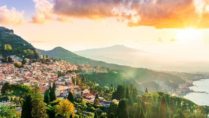 Taormina town, Sicily, Italy. View of Taormina town sunset landscape with mouintain evening...