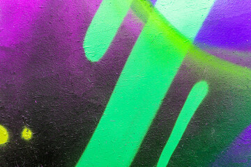 Naklejka premium Beautiful brick wall colorful street art graffiti background. Abstract creative spray drawing fashion colors painting on the walls of the city. Urban Culture, aerosol texture