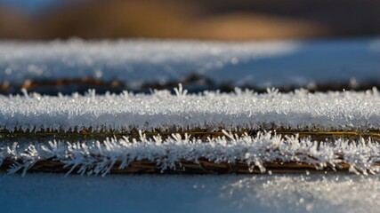 Hoarfrost crystals adorn the wooden planks, creating a delicate winter texture with frozen details and atmospheric light.