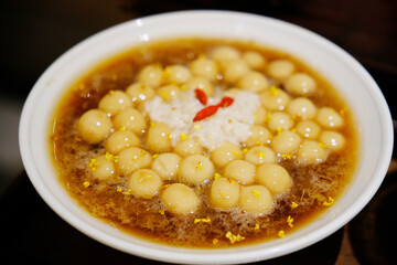 Glutinous rice balls in sweet rice wine. Traditional Chinese dessert