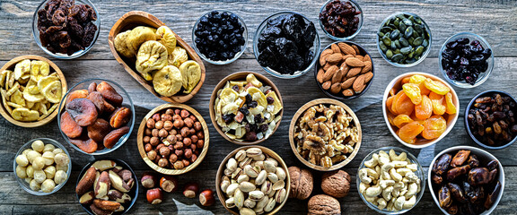 Composition with a variety of dried fruits and assorted nuts.