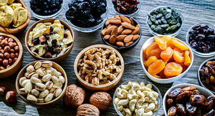Composition with a variety of dried fruits and assorted nuts.