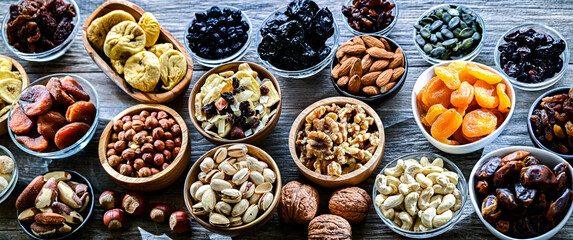 Composition with a variety of dried fruits and assorted nuts.