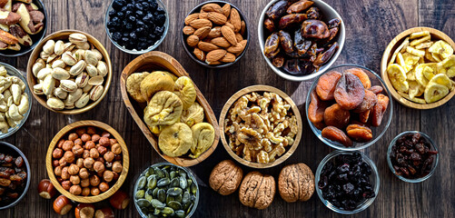 Composition with a variety of dried fruits and assorted nuts.