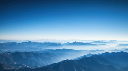 Obraz premium Vast Mountain Range Under a Clear Blue Sky