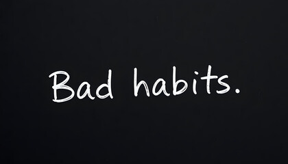 Obraz premium Paper note with phrase Bad habits on black board, closeup. Space for text isolated with white highlights, png. White tone