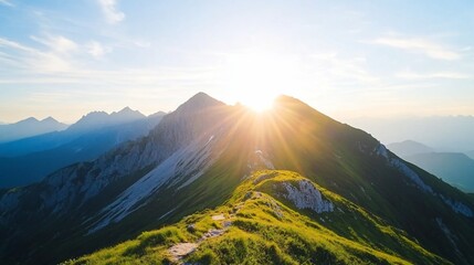 Fototapeta premium Majestic mountain range with golden sun rays shining over peak