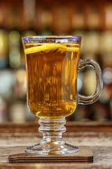 hot drink with spices, garnished with orange