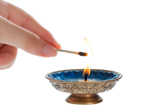 A hand lighting a candle with a Shamash during the eighth night, isolated on a white background 