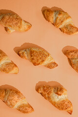 mini croissants on peach background - Croissant