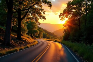 Obraz premium Golden Sunset Hues Illuminating a Winding Asphalt Road Through Lush Foliage and Rolling Hills
