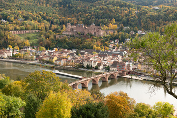 autumn view from the Philosophenweg walking trail towards the historical city Heidelberg with the...