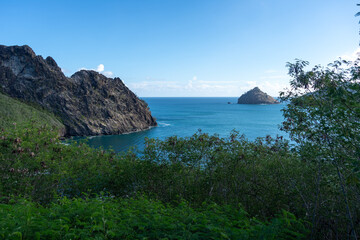 Cliffs and coastline of Taiohae Bay in Nuku Hiva, Marquesas Islands, French Polynesia